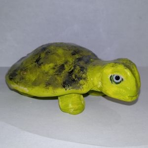 Turtle incense holder with green eyes